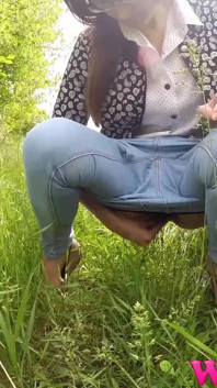 Full Bladder Skinny Brunette Pissing in the Woods in the Tall Grass