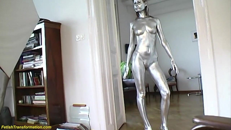 Fetish Islands: Silver metallic painted bald head statue mannequins posing
