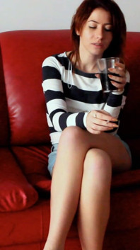 Skinny Redhead Smoking on a Couch