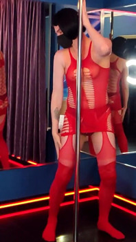 She Dances in a Red Bodysuit, as if Someone Is Going to Take Her Right at the Pylon