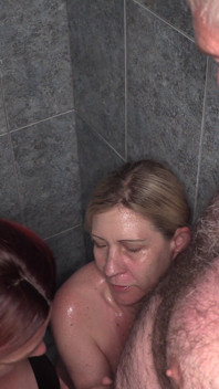 Chubby Readhead and Blonde Sporty MILF Get Pissed on by Many Mens and End up Kissing and Sharing Piss Together