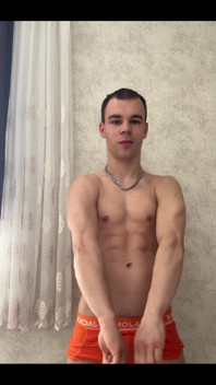 Cute Athlet Boy Showing Muscle