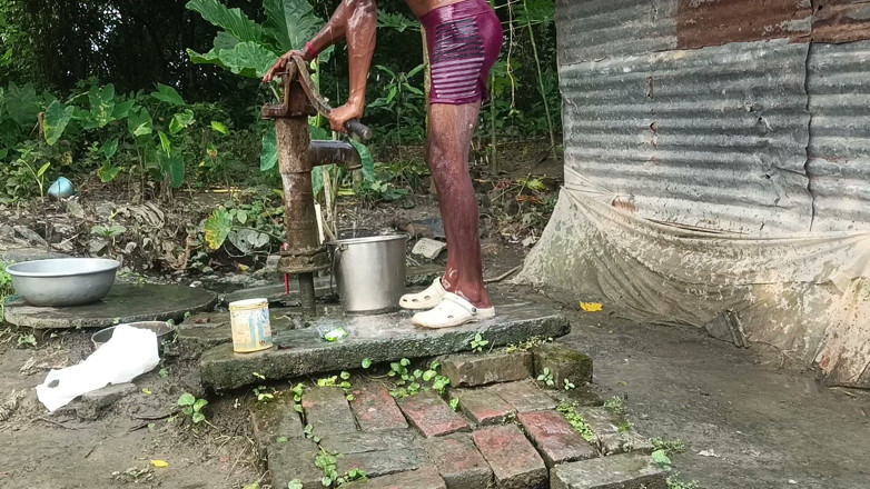 Ranjit Roy: Black mature man bath in desi style. Showing big dick.