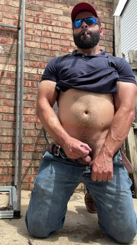 Booted Bearded Fella Cigar and Edge Out Back