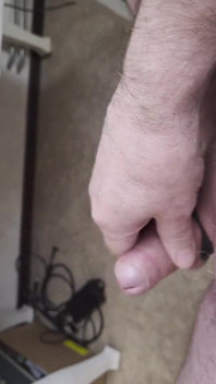 My Friend Sits in a Chair and Jerks His Cock While Watching the Video Until He Orgasms