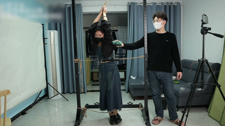 Asian bondage: My Girlfriend Is Fixed to a Metal Stand, Tickling Her
