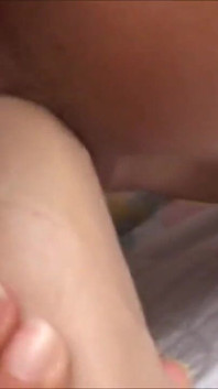 Amateur on the bed at home rubs her hairy pussy