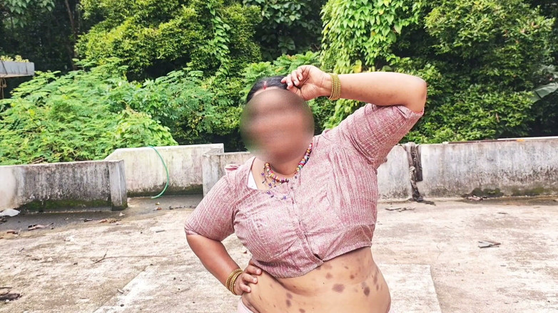 Anne Ipe: A Full-figured Woman in a White Skirt and Pink Top...