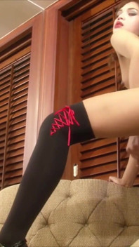 T-girl Alice strokes her cock hard