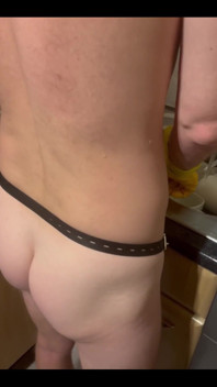 My Chastity Sub Washing the Pots for Me Naked in His Chastity Cage and with His Marigolds on
