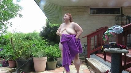 BBW nurse Vicki adventures with friends: Out doors drying off after my hosing lol and putting...