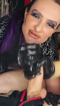 Two Mistresses in Latex Suits Jerk off a Slave's Cock.