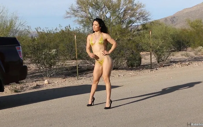 Babe Stare: Tia walks around in a tiny bikini to show off...