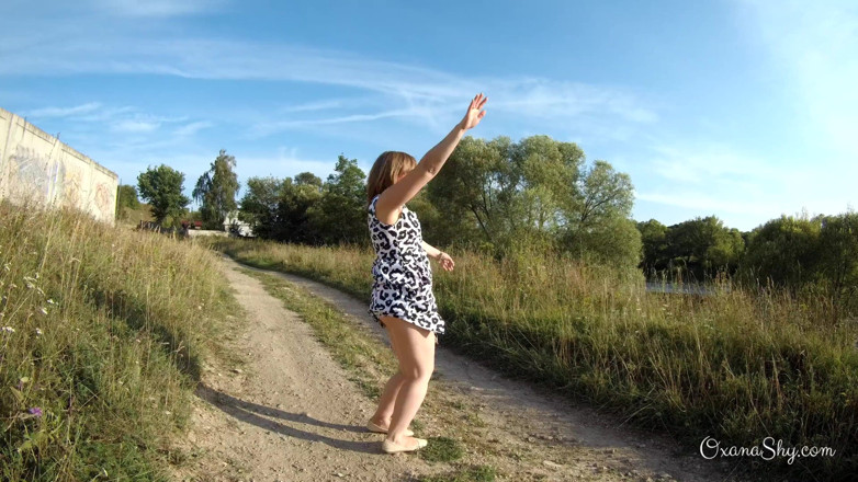 MILF Oxana: Flashing and naughty fun at the riverside