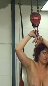 Mature Redhead MILF Endures Needles and Heavy Weights