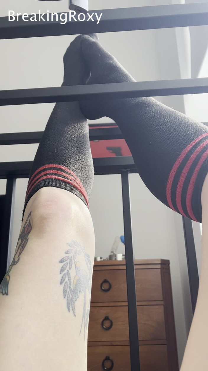 Roxy the Brat: Caged Slave Girl in Knee High Socks Rubs Feet Against...