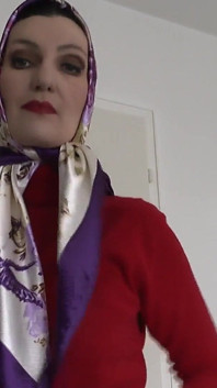 Lady Victoria Valente Showed Elegant Satin Headscarves with a Red Cashmere Turtleneck Sweater