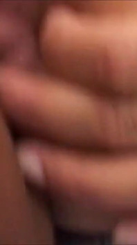 Amateur on the bed at home rubs her hairy pussy