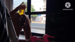 Sissy in Pink Dress Anally Takeing 1.3 Liters by the Front Window During Daylight