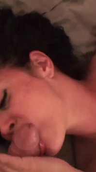 Nasty brunette sucks his cock in POV on the bed