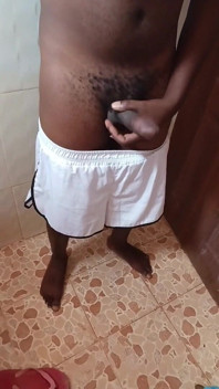 Horny African Male Almost Caught Flexing His Hard Dick in the Bathroom