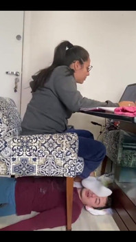Kiffa Uses Slave as Footstool as She Uses Her Notebook