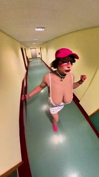 Busty Bimbo Walks Through the Hallway