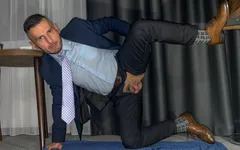 Suited men with open crotch is pissing like a dog and rides the dildo and cums handsfree