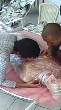 Plastic Wrapped Mature Slut Licked and Facesat by Horny Couple