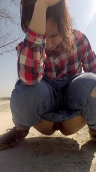 Desperate Babe with Full Bladder Empty Her Bladder and Pee on a Dirt Road