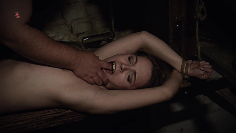 Inquisition and prison world: The Rack - Blonde Maid Alice Tormented on a Hard Wooden...