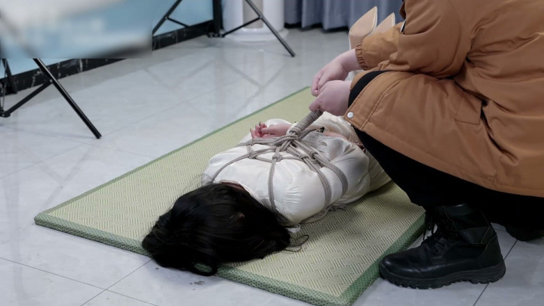 Asian bondage: Girlfriend in a Dress and Stockings, Bound by Rope