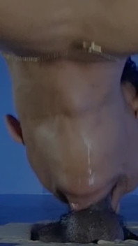 Sucking a Huge Black Cock in a Glory Hole
