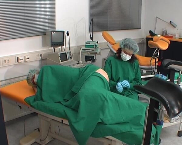 Rubber & Clinic Studio - 1ATOYS: Nurse in green surgery outfit