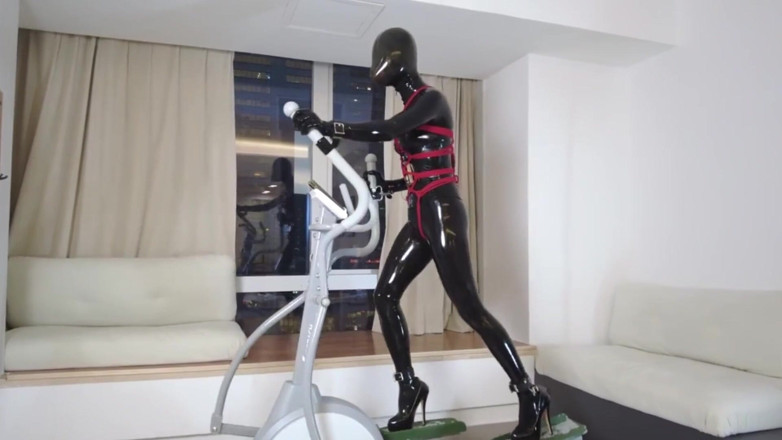 Aisan girl bondage: Mz27 - a Girl Bound in Latex Walks on a Treadmill