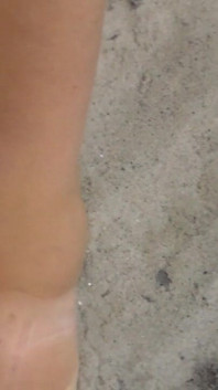 Jen Shows up Her Naked Feet in the Sand