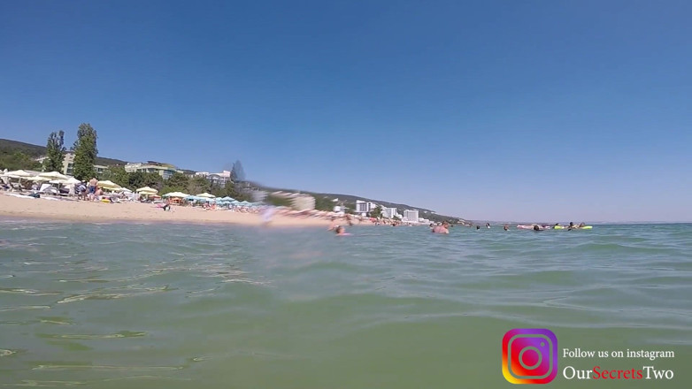 Our Secrets: She jerks him under the water on a beach full...