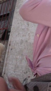 Naughty blonde and brunette lesbos lick each other in a deserted street