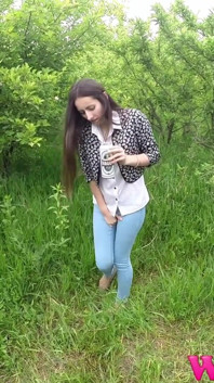 Skinny Brunette with Full Bladder Has to Pee in the Forest and Wet the Tall Grass Touching Her Wet Pussy