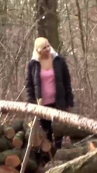 Mature blonde woman in fishnet fucked on the log