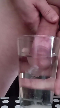 Cumming in a glass of hot water 
