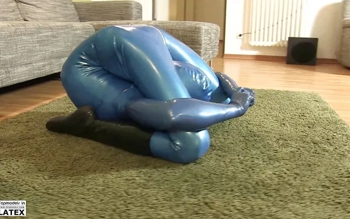 Fem Latex: She enjoys the tight horny feeling of rubber during flexible...