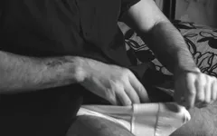 The Boy Jerks off Close-up with a Condom and Cums Loudly Into It.