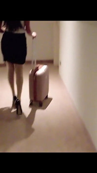 MILF in Stockings and Heels Walks Through the Corridors of a Hotel