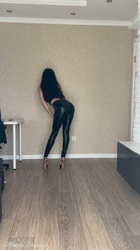 Striptease in Black Shiny Leggings, Leather Bra and High Heels