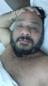 Indian Daddy Lying on the Bed Teasing and Posing for You