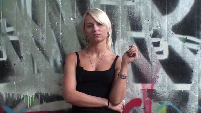 Femdom Austria: Lovely blonde teen smoking a cigarette outdoors