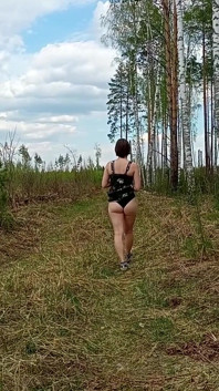 Pretty Woman Walking Through the Forest Showed Her Ass