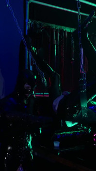 The rubber Domme the giant dildo and the gimp
