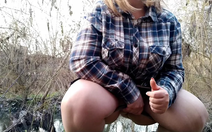 Elena: BBW in torn pantyhose pissing on the river bank.